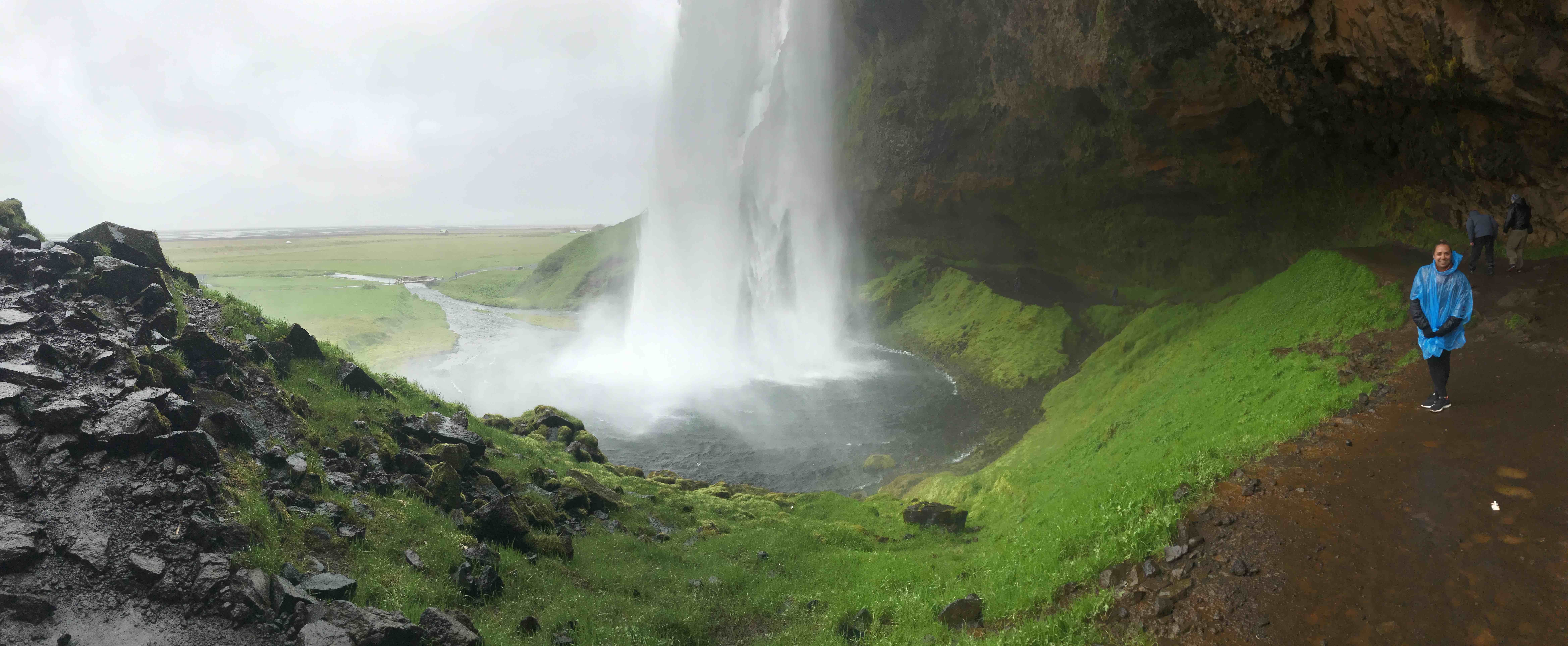 behind-waterfall-